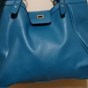 Large woman turquoise purse